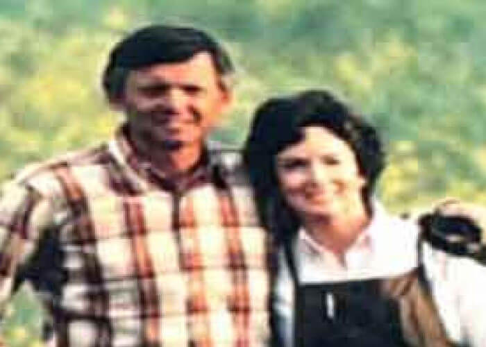 Ron and Kathleen Spicer standing side-by-side in a field.
