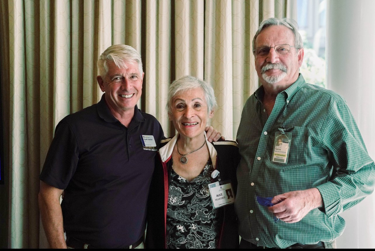 Alice Villalobos stands between Dean Mark Stetter on the left and Executive Associate Dean Emeritus John Pascoe on the right.
